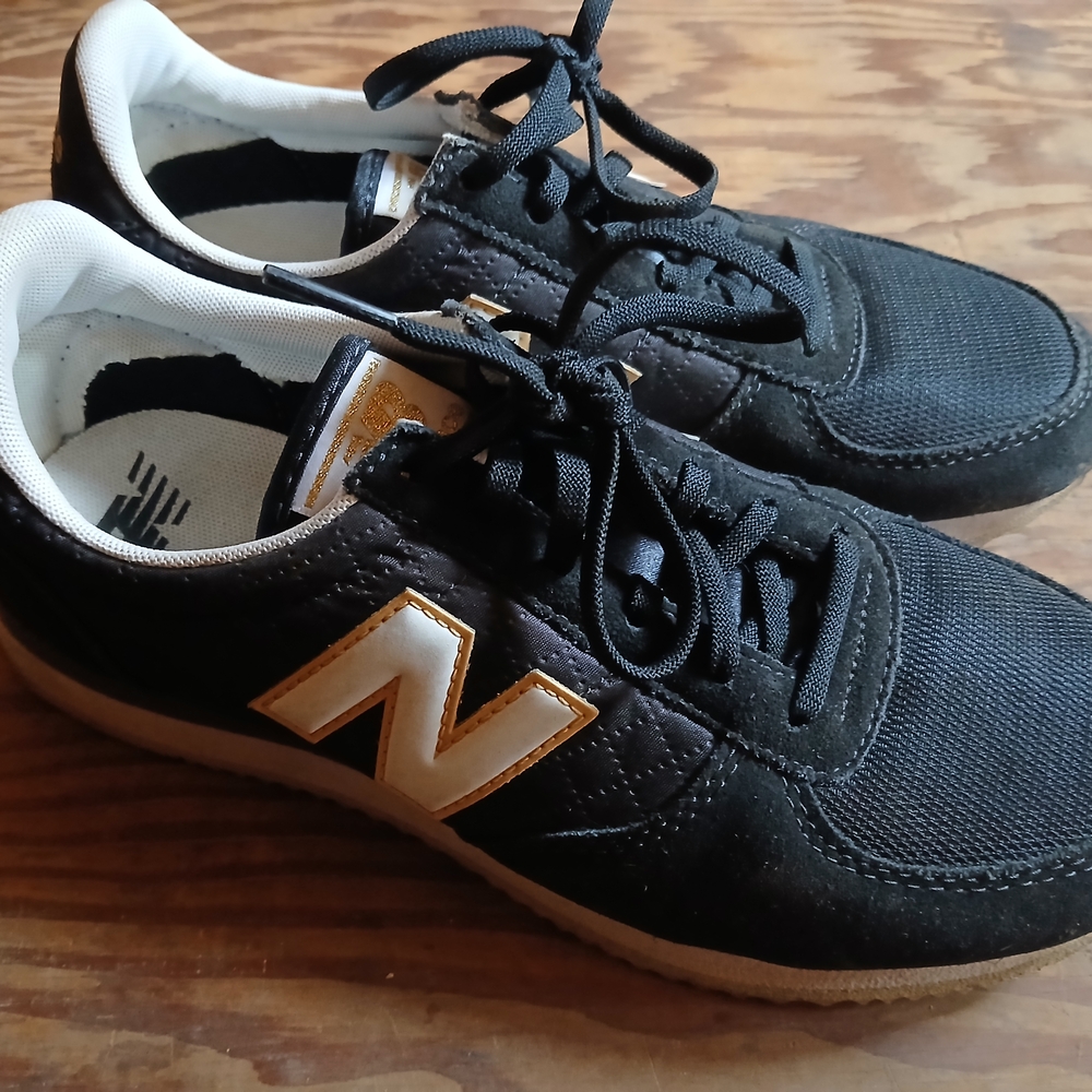 New Balance Black and Gold Sneakers